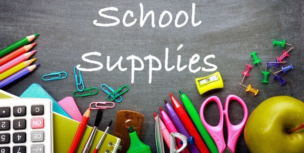 school supplies on chalkboard background