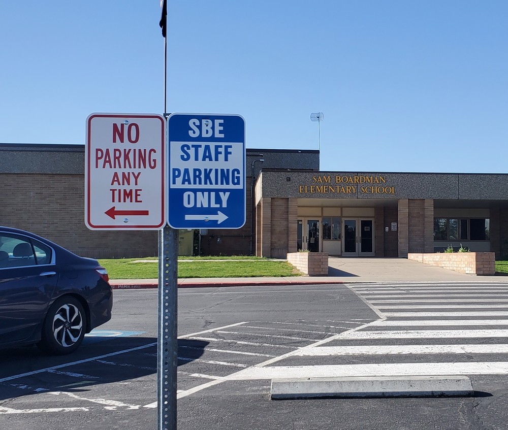 No parking and staff parking signs in front of SBE