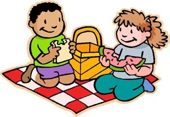 two kids eating a sandwich and a watermelon on a picnic blanket